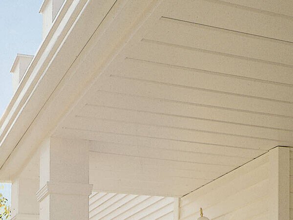 White aluminum soffit panels under a porch roof overhang
